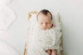 Off-white newborn alpaca mohair wrap photography prop.